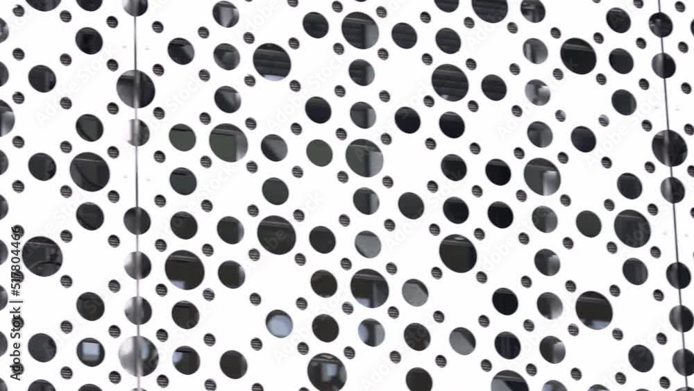 Futuristic part of the building design close-up. Abstract facade design. Metal in modern urban architecture. The appearance of modern buildings. Construction industry. High quality FullHD footage