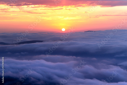 sun over pink and blue clouds, clouds, wavy fluffy clouds to the horizon, sunset, magical colors, purple and pink background, orange light, majesty and tranquility of nature, amazing sky, harmony 