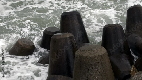 Ocean waves against breakwater.