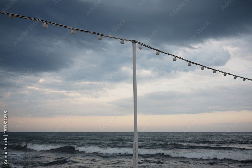 street garland against the backdrop of a stormy sea