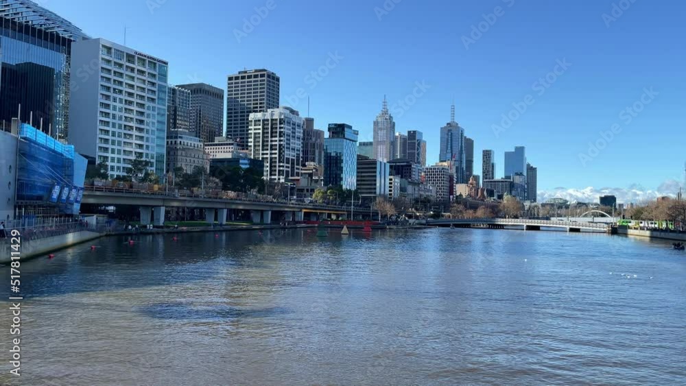 Melbourne city views the Yarra River with a train passing through on a sunny day. Melbourne city views the Yarra River with a train passing through on a sunny day.