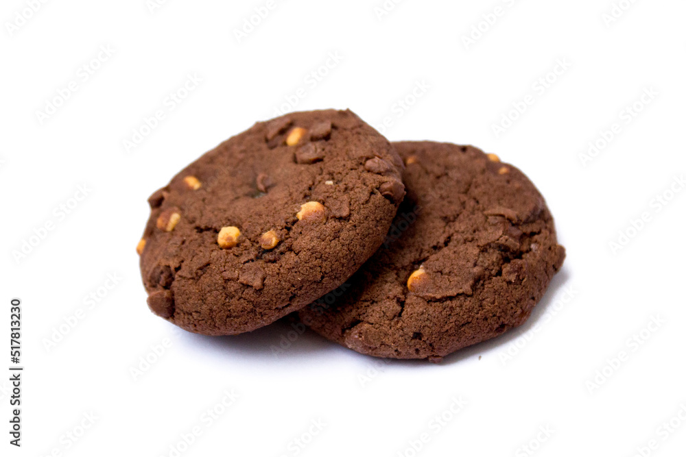 two chocolate chip cookies lie on a white background two chocolate chip cookies lie on a white background