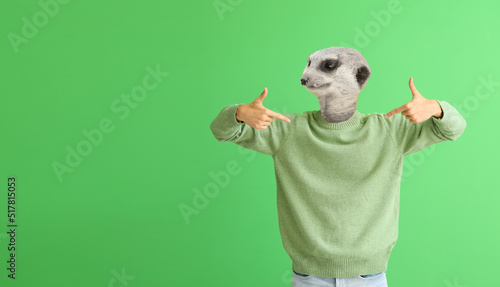Man with head of meerkat on...