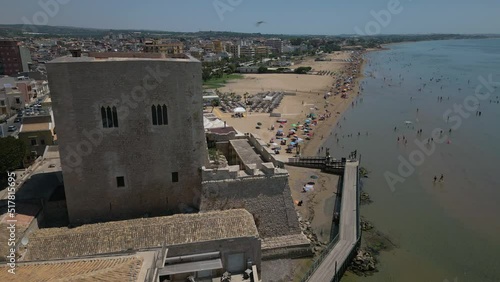 flying past Torre Cabrera toward beach in Pozzallo Sicily photo