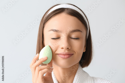 Pretty young woman with gre...