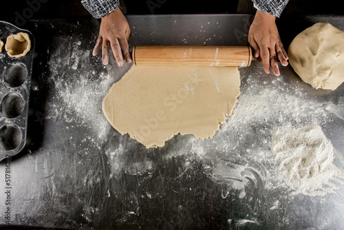 person kneading dough