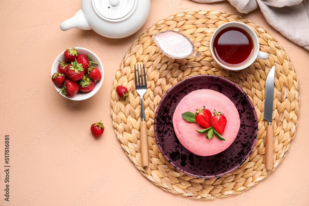 Composition with tasty pancakes, strawberry, sour cream and tea on table Composition with tasty pancakes, strawberry, sour cream and tea on table