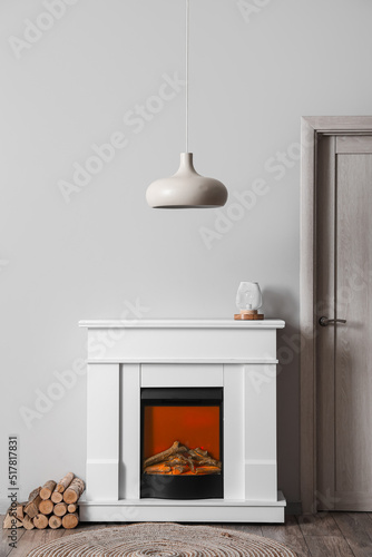 Modern fireplace with lamps...