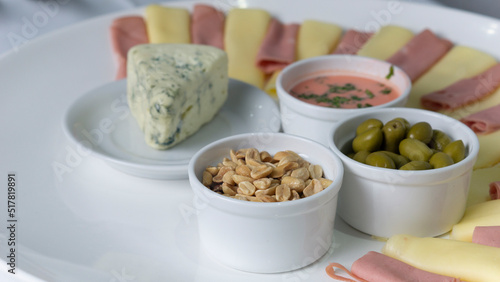 plate with chesse nuts and snacks