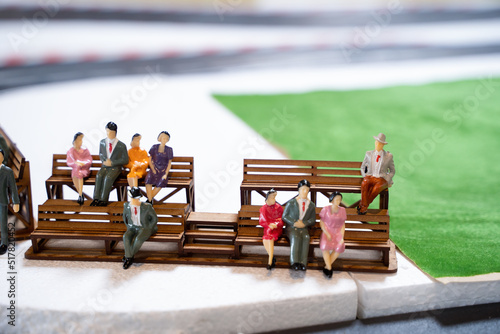 Wallpaper Mural Miniature doll in race track, Miniature people watching racing cars in the field. Selective focus Torontodigital.ca