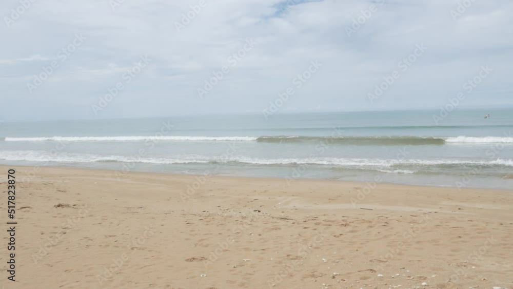 Beach sea sand and sky. Landscape view of beach sea in summer day. Beach space area with peaceful sea in sunshine daytime Beach sea sand and sky. Landscape view of beach sea in summer day. Beach space area with peaceful sea in sunshine daytime