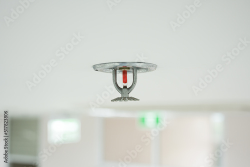Fire fighting equipment, sprinkler on white ceiling background.Automatic head fire sprinkler extinguisher selected focus on sprinkler.Fire fighter safety concept.