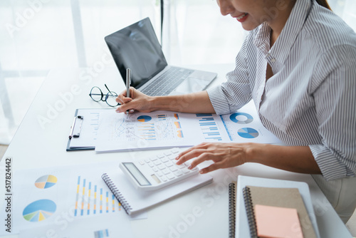 Businessman analysis marketing plan, Accountant calculate financial report, computer with graph chart. Business, Finance and Accounting concepts.