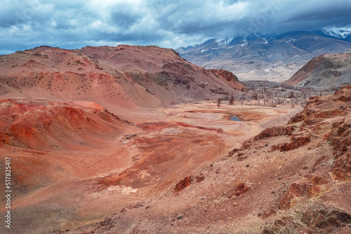 Beautiful lifeless landscape mountains Altai Republic Russia, texture of red sandstone in Mars valley, aerial top view with sunlight