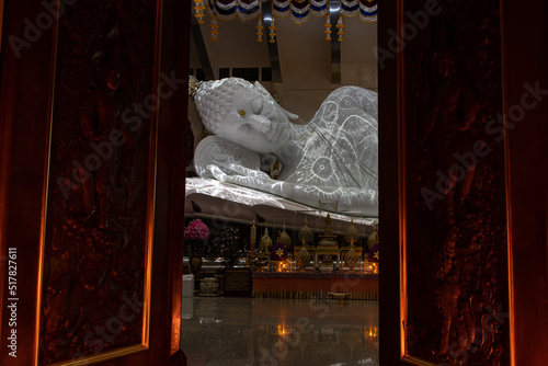 Beautiful biggest reclining white marble nirvana Buddha at Wat Pa Phu Kon, Udon Thani Thailand.