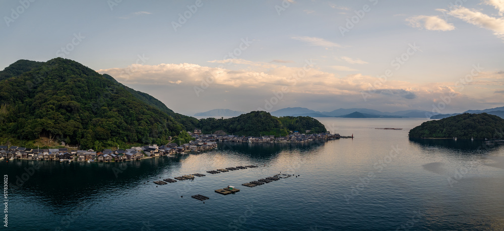 Panoramic view of Ine fishing village and floating docks in bay at sunset