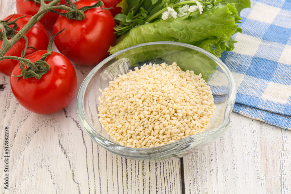 Raw sesame seeds in the bowl Raw sesame seeds in the bowl