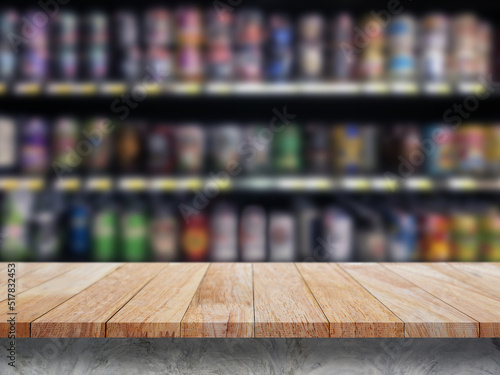 Empty wooden bar counter with defocused background and bottles of restaurant, bar or cafeteria background /for your product display