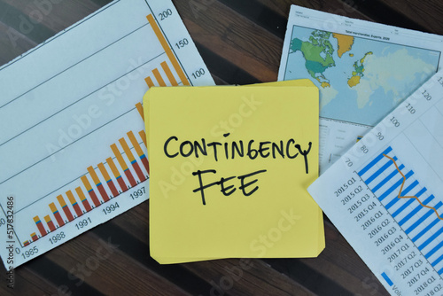 Concept of Contingency Fee write on sticky notes isolated on Wooden Table. photo