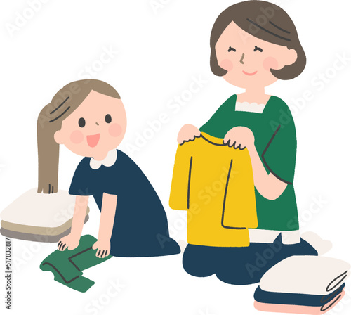 洗濯物を畳むお母さんと女の子