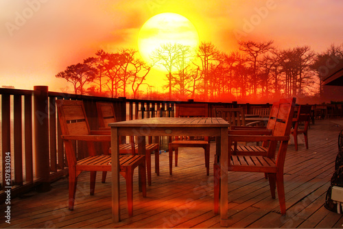 wood terrace with wooden table and desk  at view point with sun set nature background © apithana