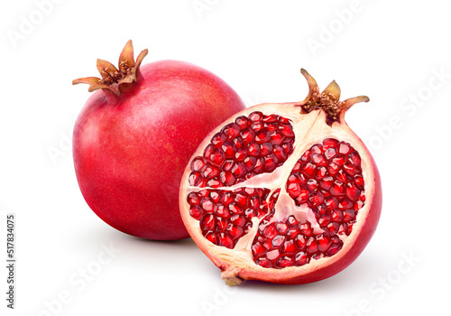 Fresh ripe pomegranate with cut in half isolated on white background. Clipping path. photo