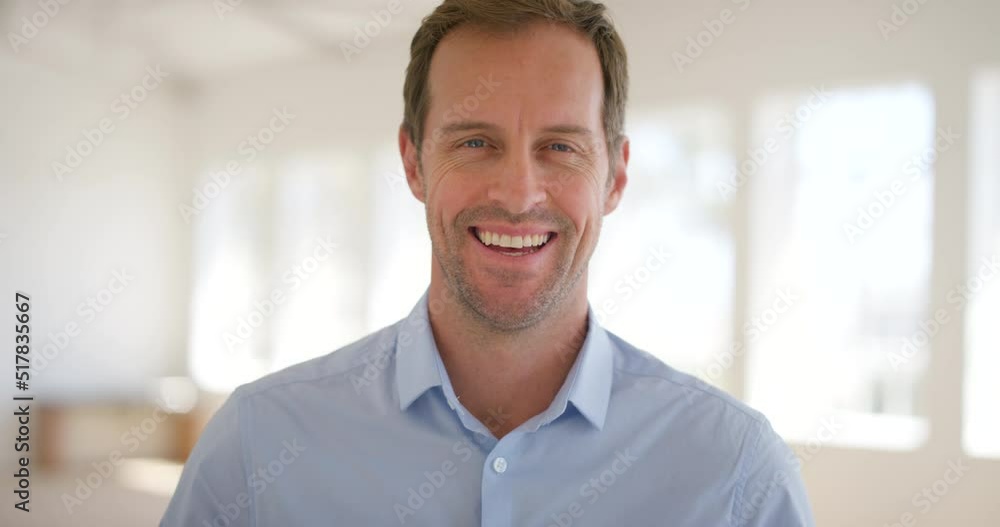 Portrait of a confident business man and real estate agent standing in an empty house on show. Face of a happy and friendly entrepreneur smiling and laughing. Realtor selling property with success Portrait of a confident business man and real estate agent standing in an empty house on show. Face of a happy and friendly entrepreneur smiling and laughing. Realtor selling property with success