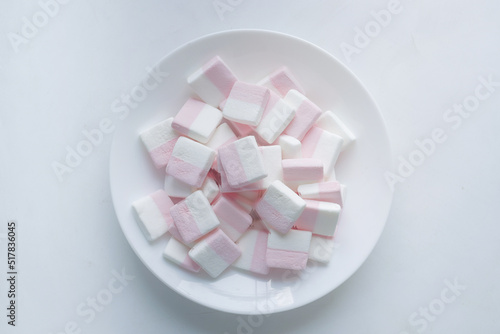 marshmallow candy in a bowl on white background 