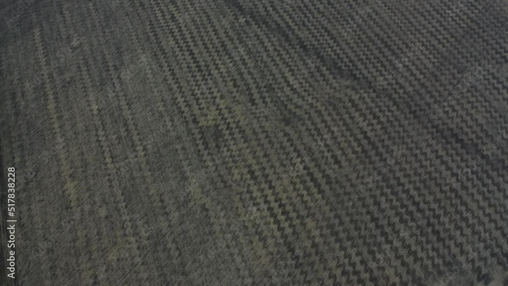 Drone view of dry field after collecting harvest. Seasonal works at agricultural filed aerial view. Drone view of dry field after collecting harvest. Seasonal works at agricultural filed aerial view.