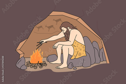 Caveman sitting in cave near bonfire warming. Male prehistoric person making fire during ancient ages. Vector illustration. 