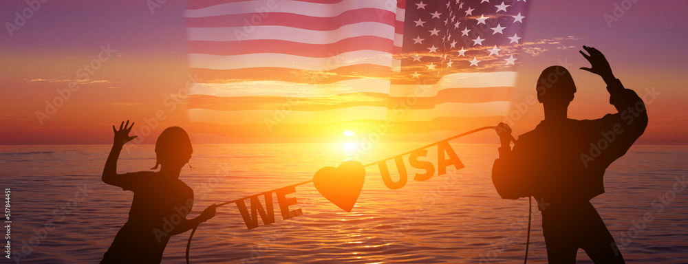 Happy girls and flag . USA celebration. Sunset background.