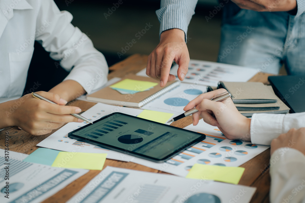 The atmosphere in the meeting room where the businessmen are meeting, information papers and charts are placed on the table to support the business planning meeting to grow. Business idea