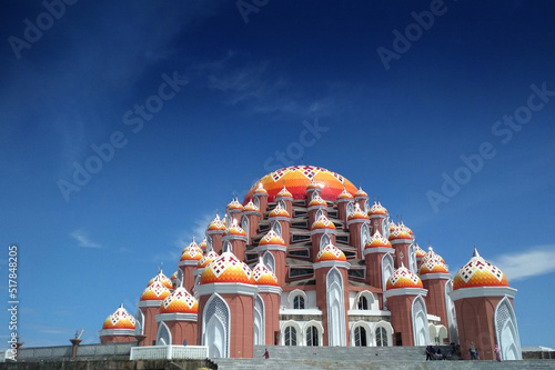 99 kubah emas mosque or 99 golden dome mosque at losari beach makassar indonesia photo