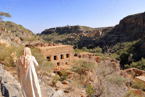 View of ruins of an abandoned village at the Wadi Bani Habib at the Jebel Akhdar mountain in Oman photo