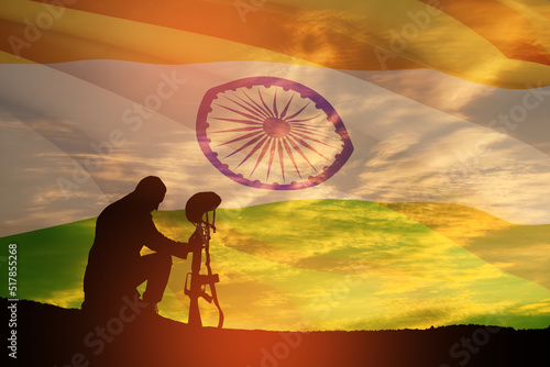 Silhouette of soldier on a background of India flag and the sunset or the sunrise. Greeting card for Independence day  Republic Day. India celebration.