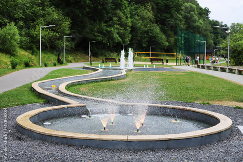 RABKA-ZDROJ, POLAND - 28 JUNE 2022: Water health path with fountains of various health effects in Rabka-Zdroj, Poland.