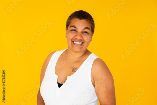 upper body of smiling woman on bright yellow background