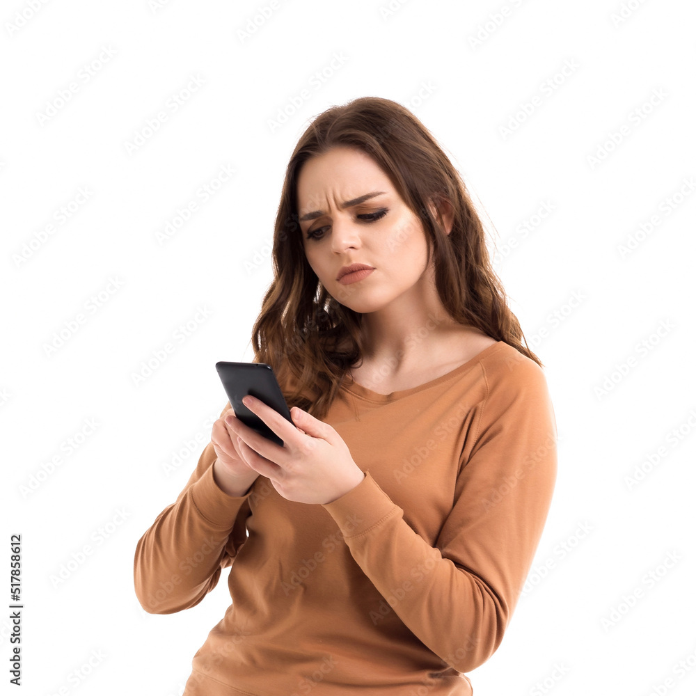 The girl is talking on the phone. Online communication. The girl is talking on the phone. Online communication.