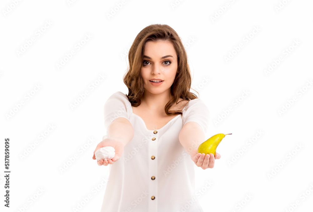 The girl chooses between healthy food and harmful. The girl chooses between healthy food and harmful.