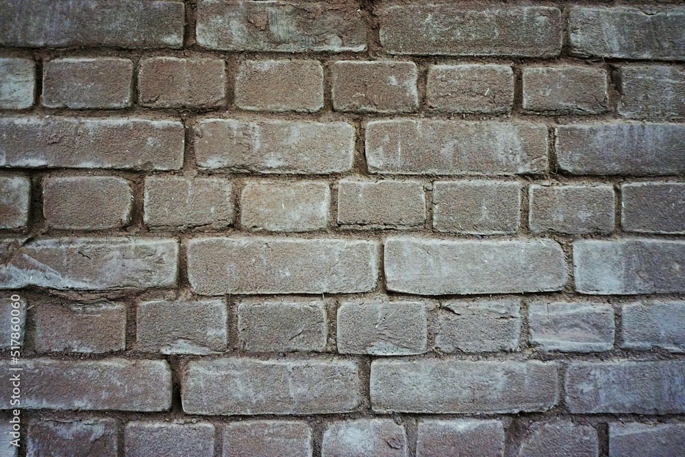 Alte verwitterte braun-graue Backsteinfassade Alte verwitterte braun-graue Backsteinfassade