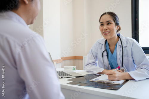 Professional doctor explain the results of a physical examination to  patient and advice on medication. Female doctor talks and records the patient s symptoms. Hospital   medical  health care