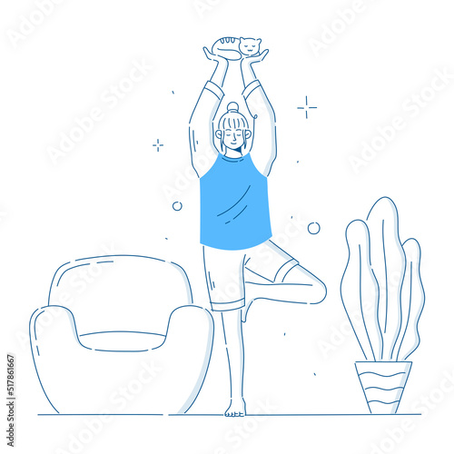 Girl doing yoga at home holding Cat