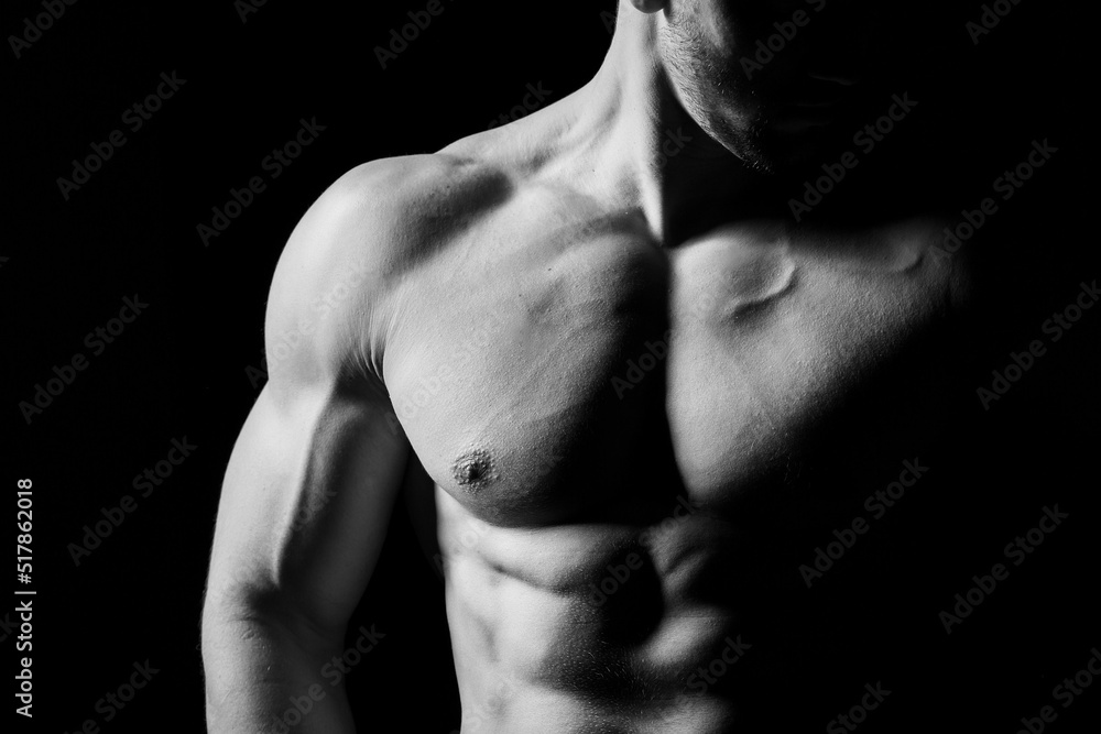 Muscular and sexy torso of young man having perfect abs, bicep and chest. Male hunk with athletic body. Fitness concept. Muscular and sexy torso of young man having perfect abs, bicep and chest. Male hunk with athletic body. Fitness concept.