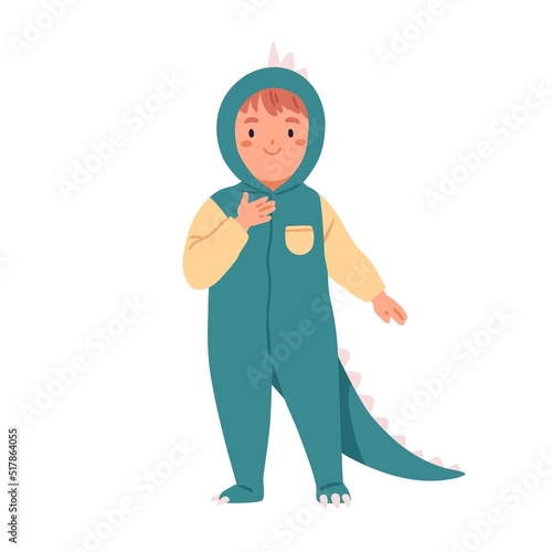 Happy kid in dino costume. Cute boy disguised in funny dragon wearing for hol...