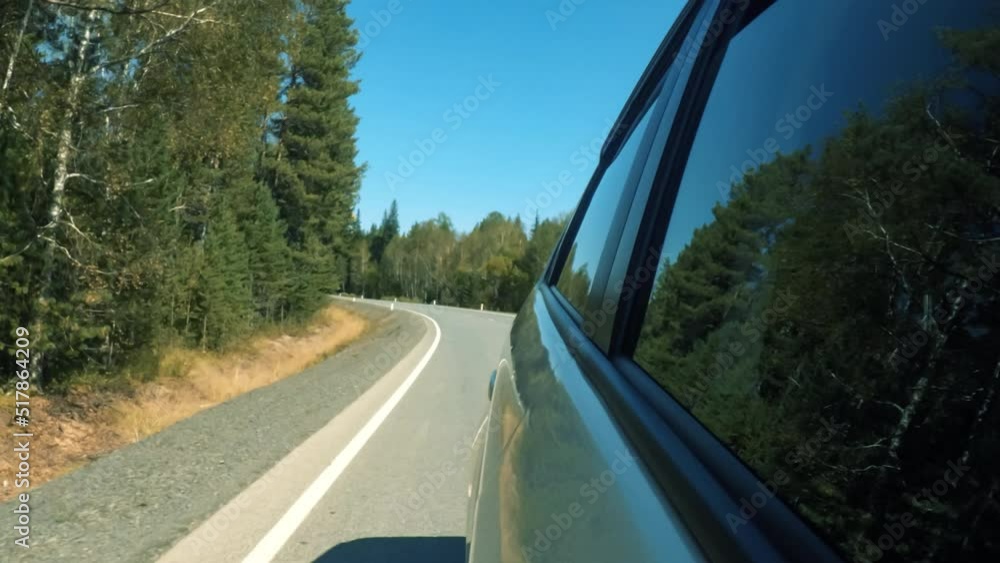 High Speed On The Open Road Fast Car Hyperlapse. Side View From the Car Window to the Road Going Through the Natural Landscape. Road trip travel concept High Speed On The Open Road Fast Car Hyperlapse. Side View From the Car Window to the Road Going Through the Natural Landscape. Road trip travel concept