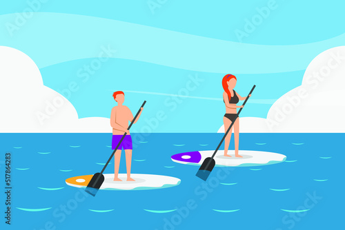 Man and woman board paddle in the ocean
