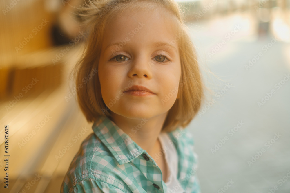 Portrait of cute boy looking at camera and smile