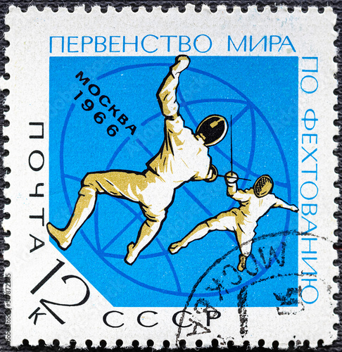 USSR-circa 1966: Postage stamp printed in the USSR with the a picture of fencing, and the inscription in Russian World fencing championship, Moscow, 1966 , from the series Sport , circa 1966