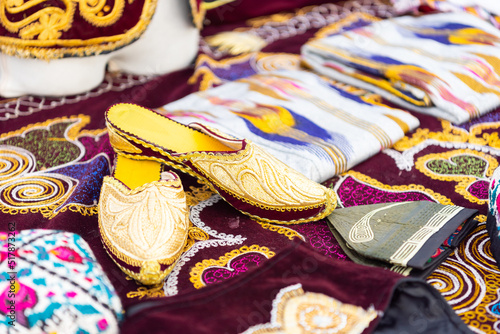 National shoes at the festival of the peoples of the world. Bright patterns and motifs in the ornament. Swap meet.