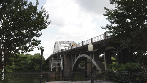 Edmund Pettus bridge in Selma, Alabama with gimbal video walking forward through trees. photo